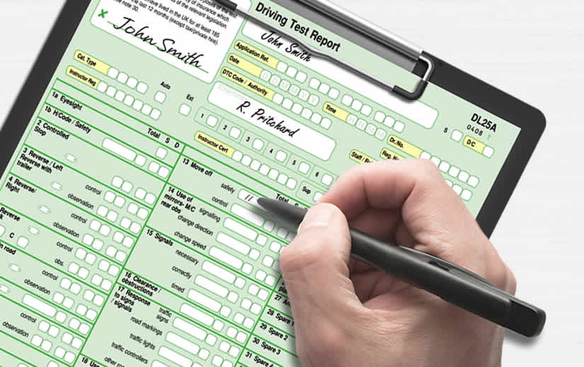 Examiner filling out the moving off section of the driving test report