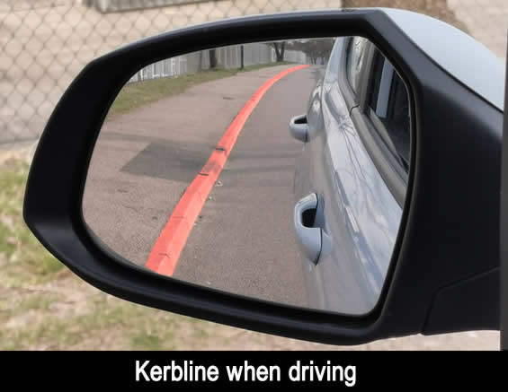 View of left, passenger door mirror when driving